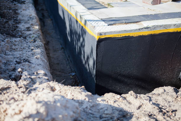 Professional Waterproofing technician working in Brownsville, TN